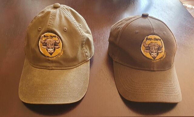 Two Bos-Japie caps with an embroidered buffalo patch